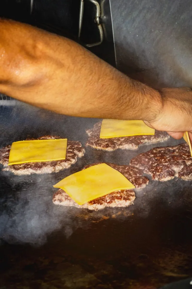 Customers eating burgers at Chop House in Garden Plaza